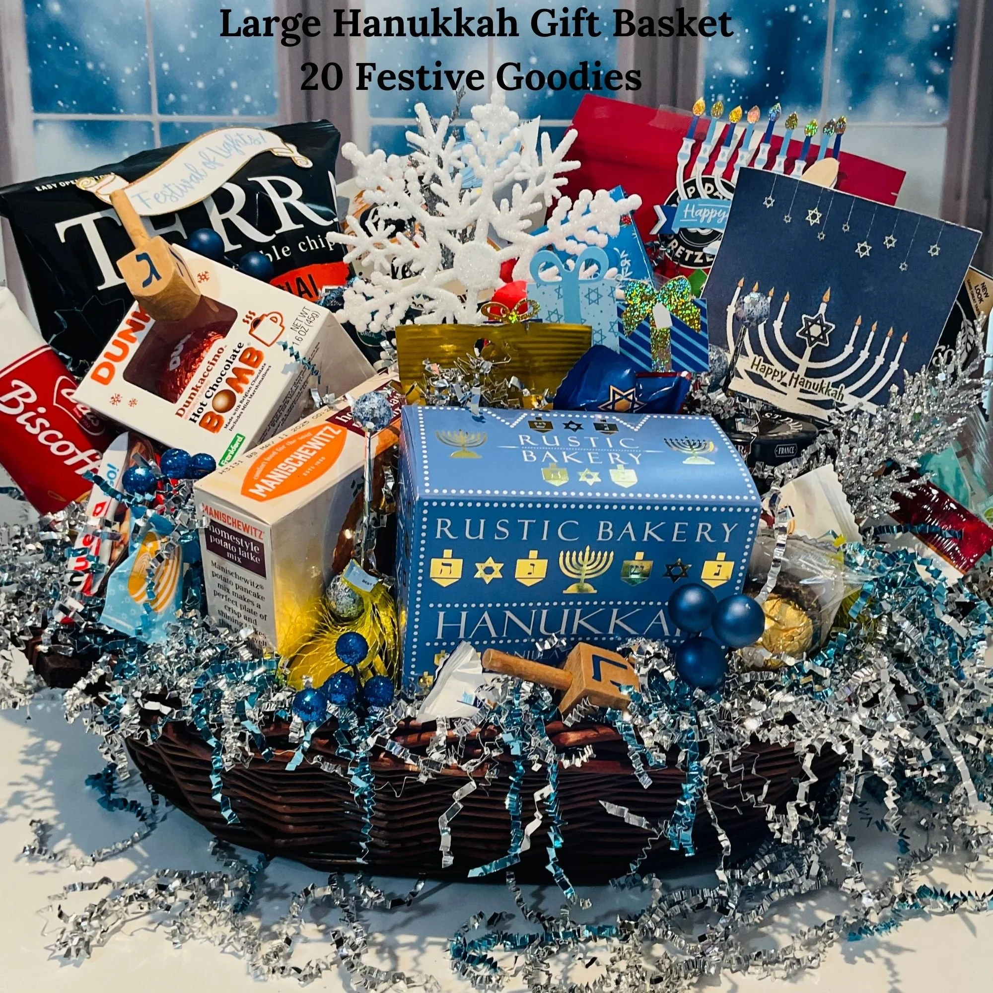 Large Hanukkah gift basket filled with 20 full-size festive treats, sweets, and holiday snacks in blue and silver décor.