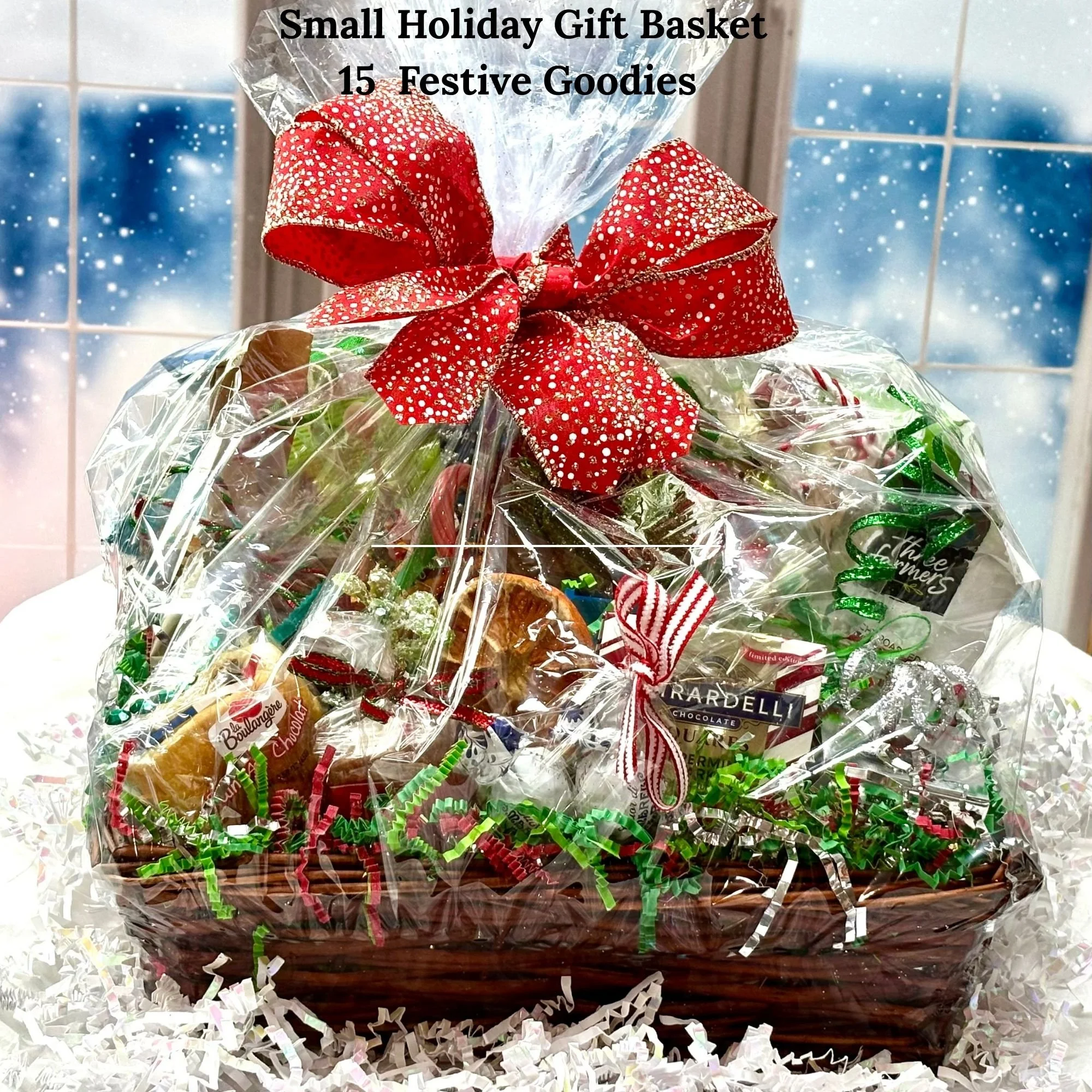 Small holiday gift basket featuring 15 full-size treats, wrapped with a red and white polka-dot bow and festive décor.