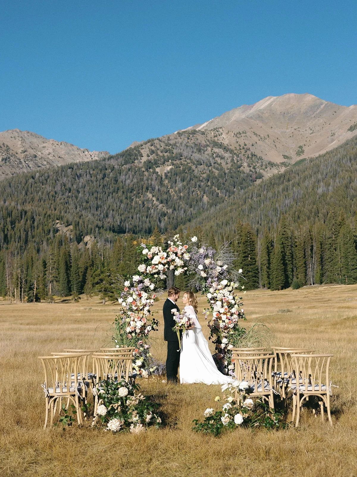 galena-lodge-bailly-spencer-elopement-intimate-wedding-celebration-sun-valley-idaho-kayla-lucio-photo-worldwide-photographer-colorful-blooms-floral-arch-22.jpg