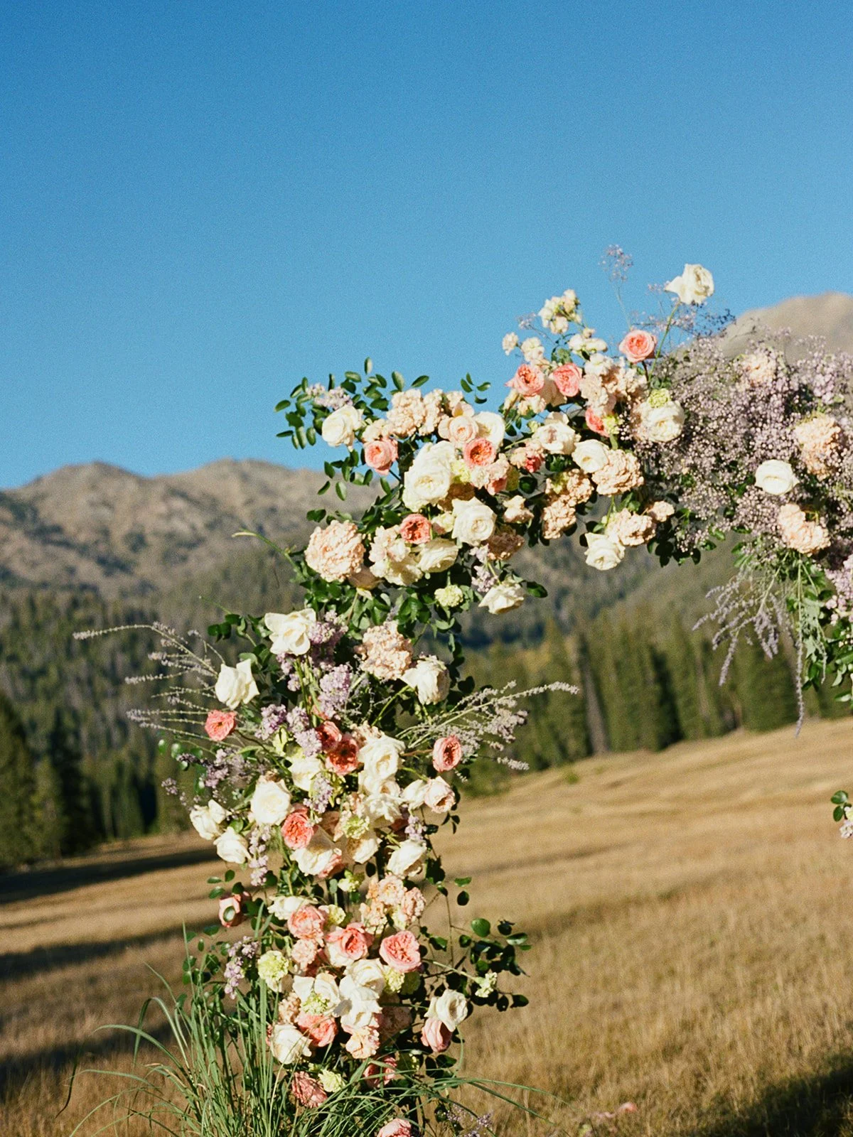 galena-lodge-bailly-spencer-elopement-intimate-wedding-celebration-sun-valley-idaho-kayla-lucio-photo-worldwide-photographer-colorful-blooms-floral-arch-5.jpg