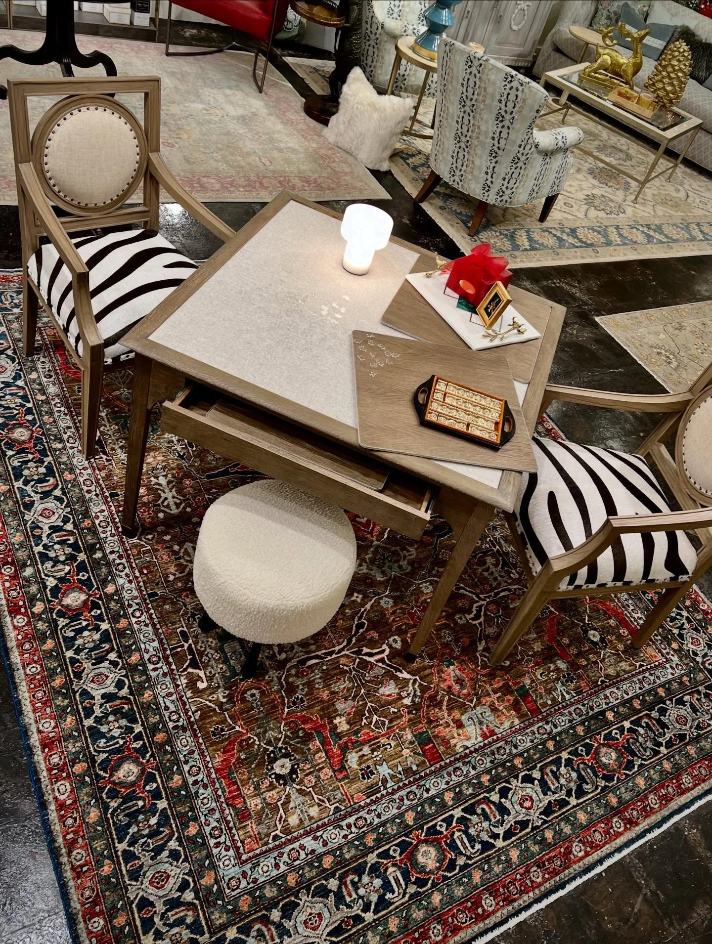 Elevate your puzzle-solving experience with this gorgeous puzzle table! Its squared top can be tilted for a different perspective and it is fitted with an inset fabric field over a storage drawer that houses four two-sides panels that can be placed o