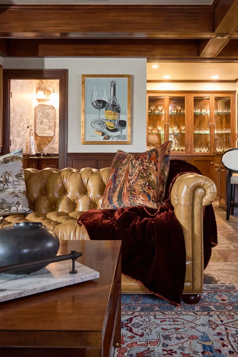Chesterfield leather sofa, Hancock and Moore, one of a kind rug, Hickory Chair coffee table.