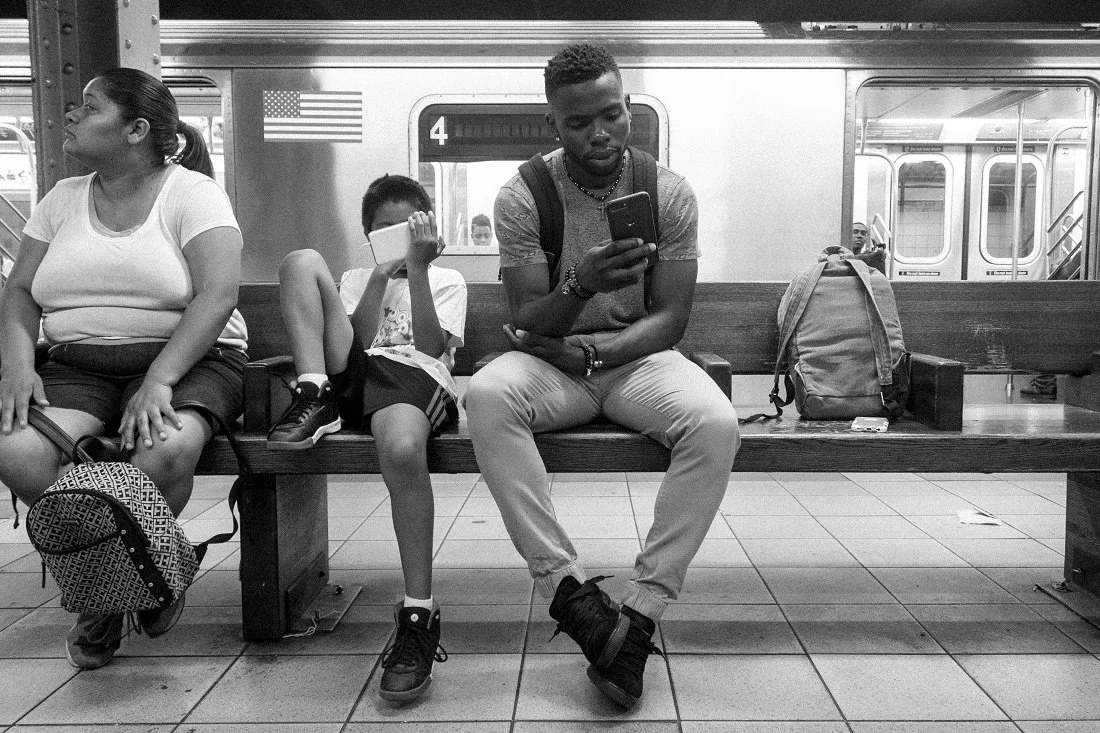 Waiting for the subway to arrive.