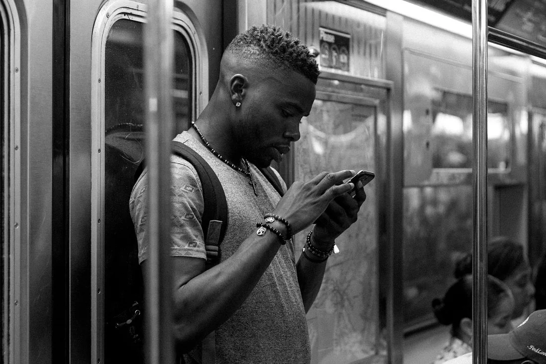 Onboard the subway en route to work.