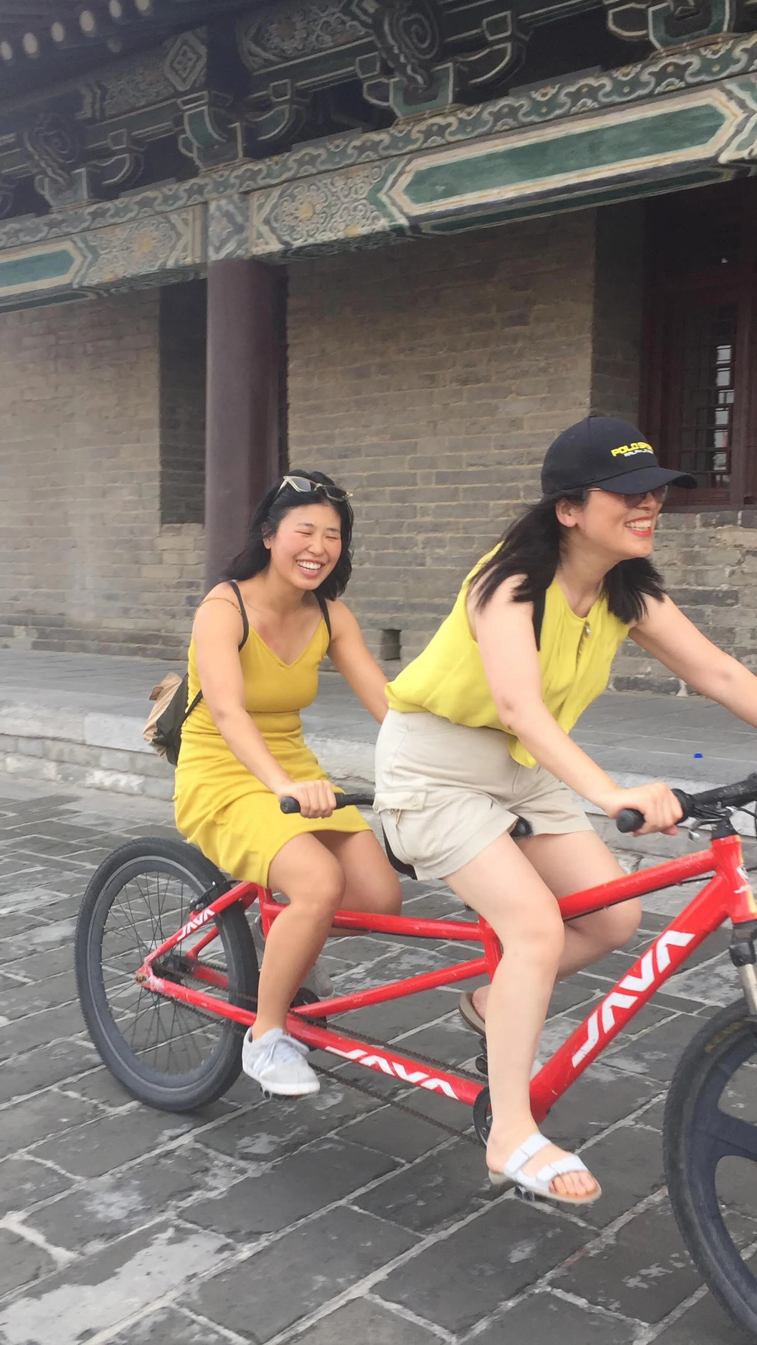Jennie riding bicycle with mom, Xi'an ancient city wall, 2019