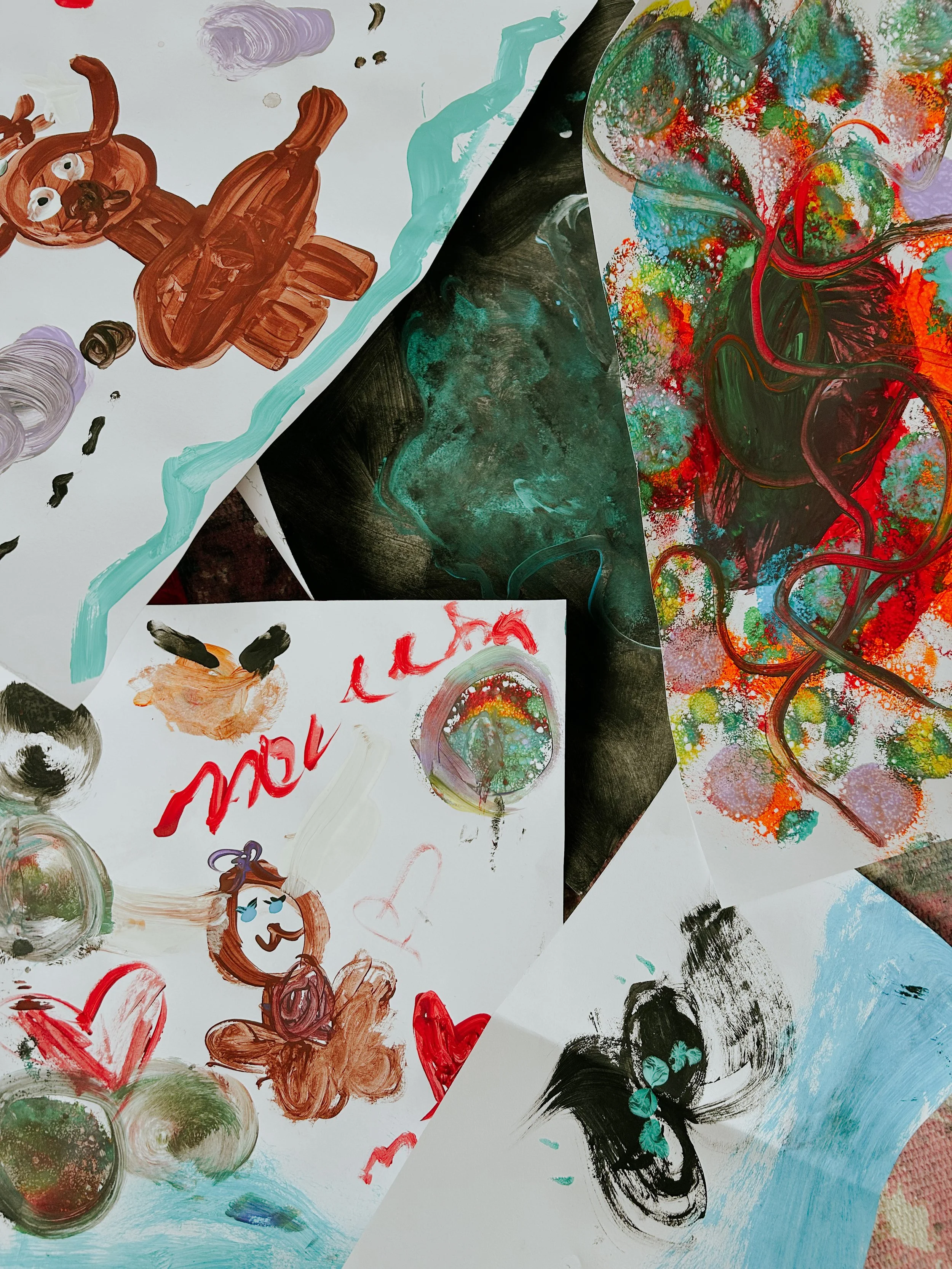 Collection of colorful children's artwork featuring abstract designs, a rainbow, hearts, a teddy bear, and various paint strokes and splashes.