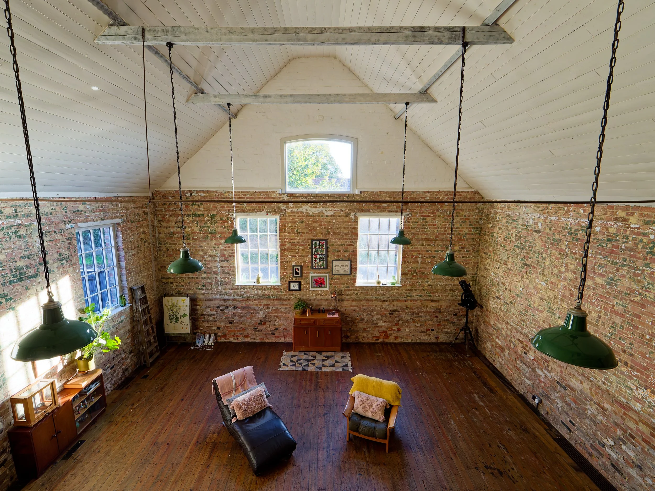 Exposed brick interior of a Former Victorian Village Hall Conversion located in Norfolk