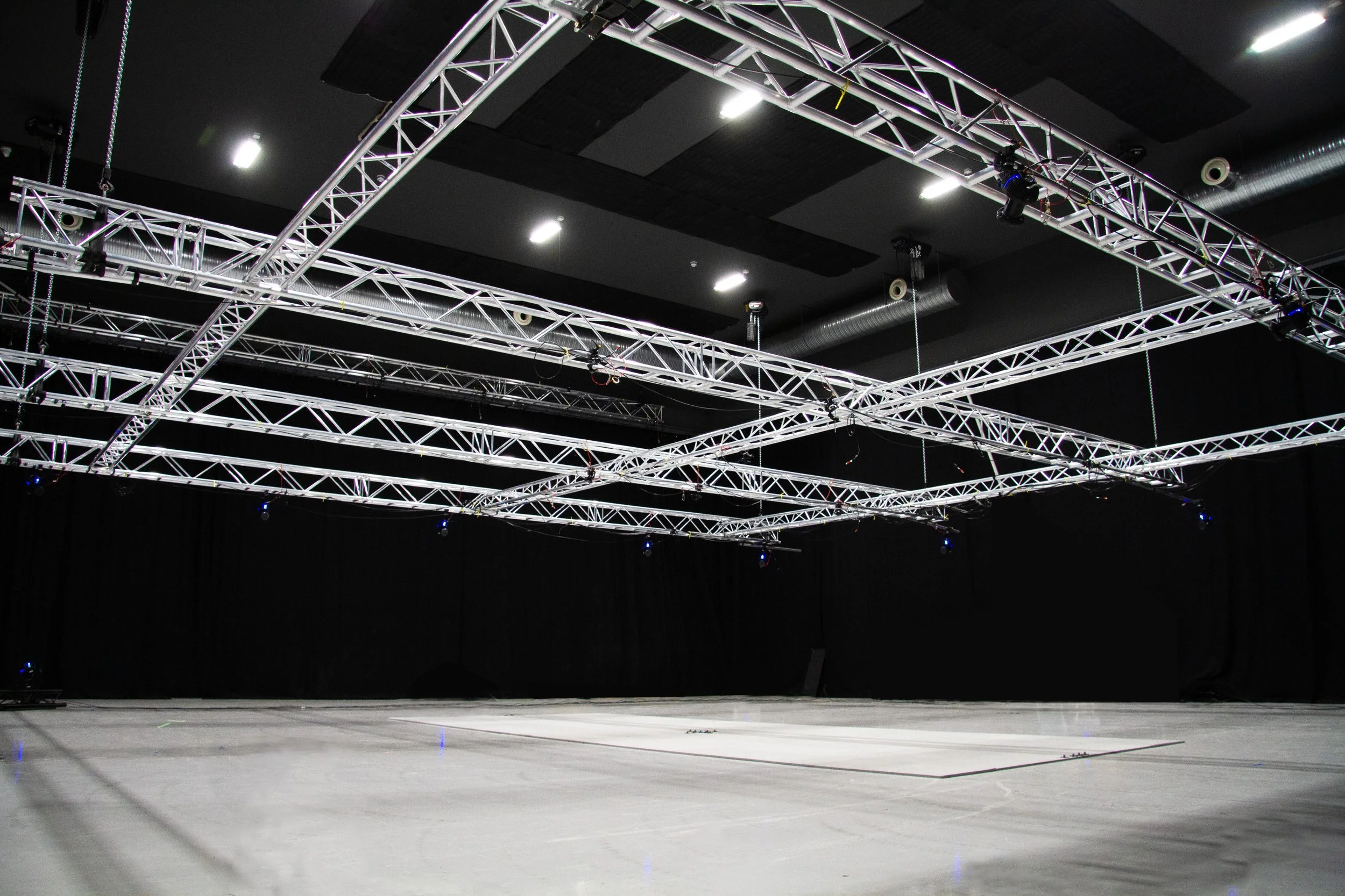 Interior of extensive photography and filming studio facility with rigging