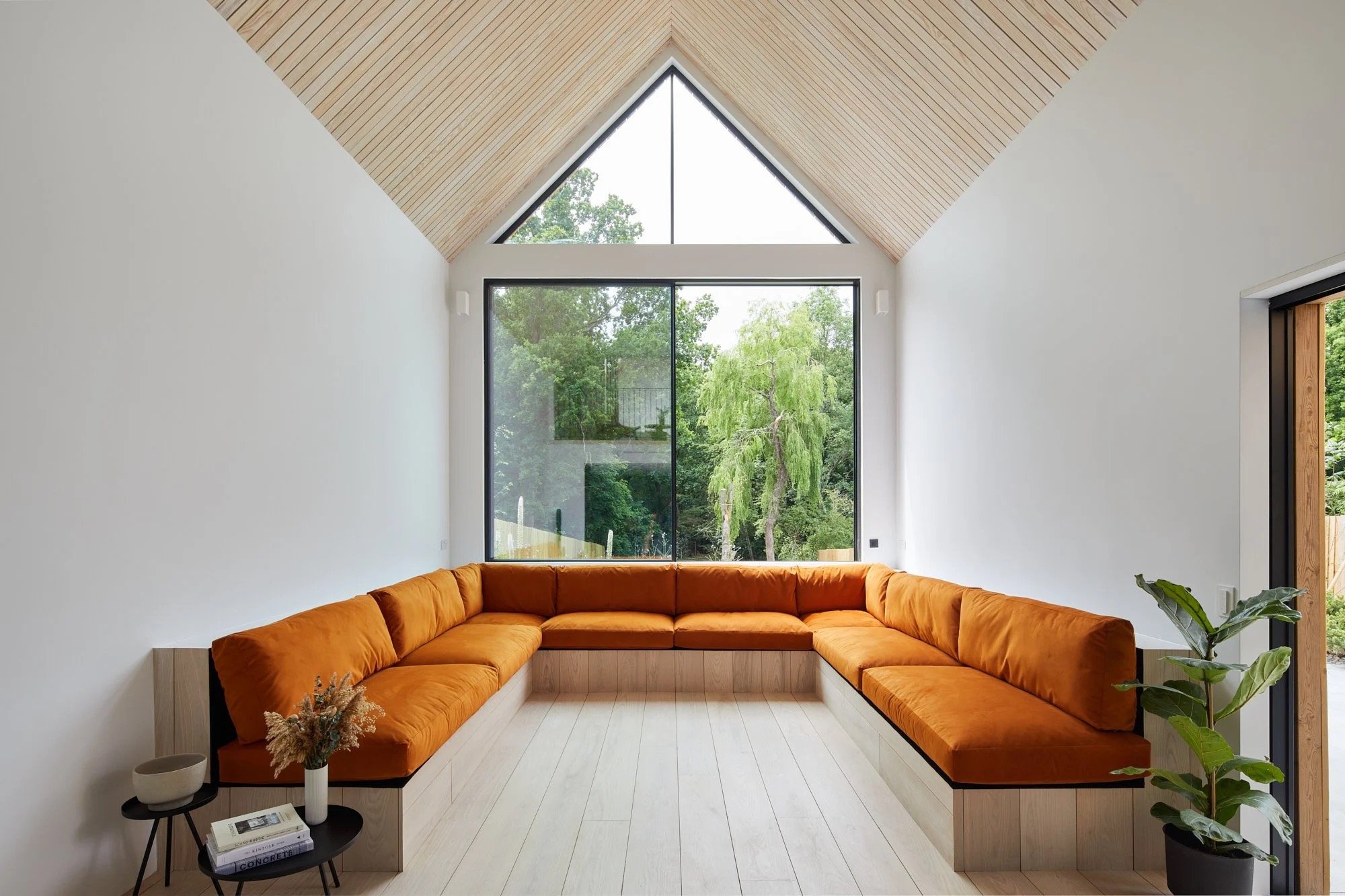 Seating are of modern house with orange seating located in Kent