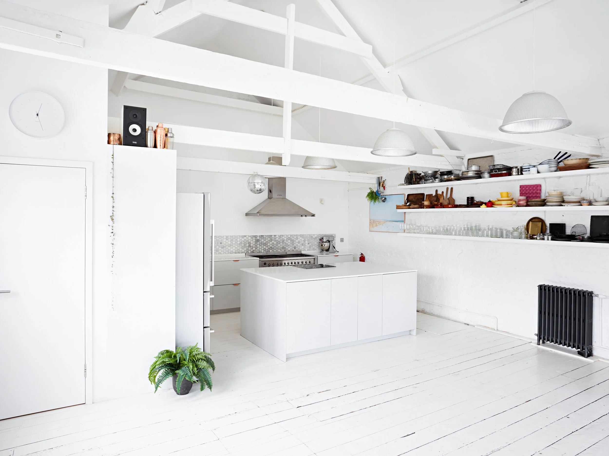 White kitchen photography studio with kitchen island, located in South East London