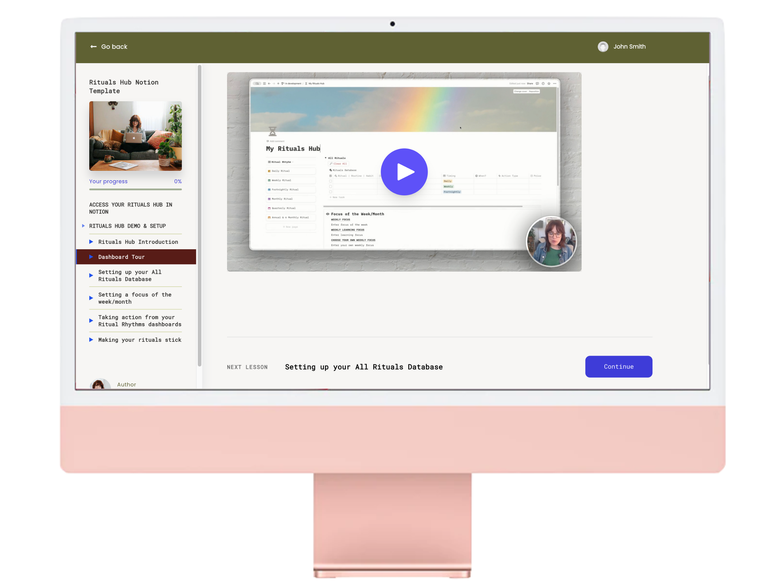 A rose imac screen with a view of a course hub of video tutorials.