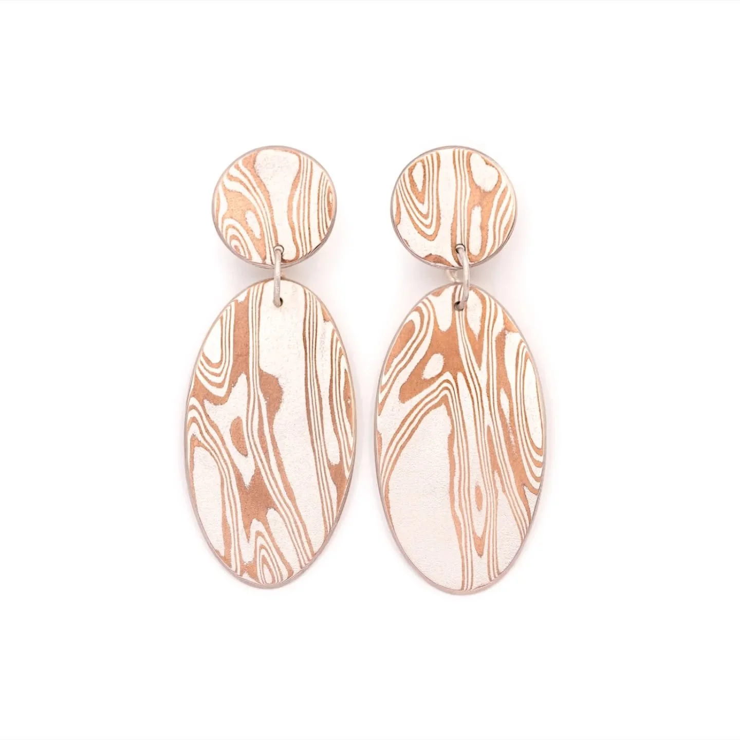 Mokume Gane earrings in sterling silver and copper.
Like a puzzle, the pattern flows seamlessly from one segment of the earrings to the other.

✨ Want to see them in person?
Come by Palazzo Bovara during Milan Jewelry Week &mdash; they&rsquo;re waiti