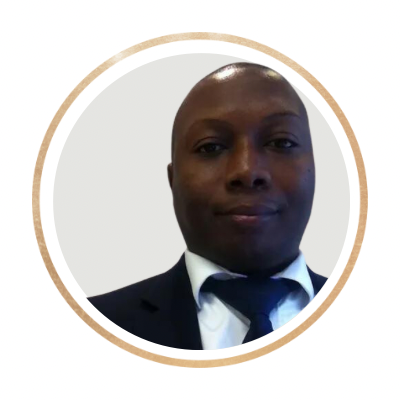 A man in a suit and tie taking a selfie with a plain white background.