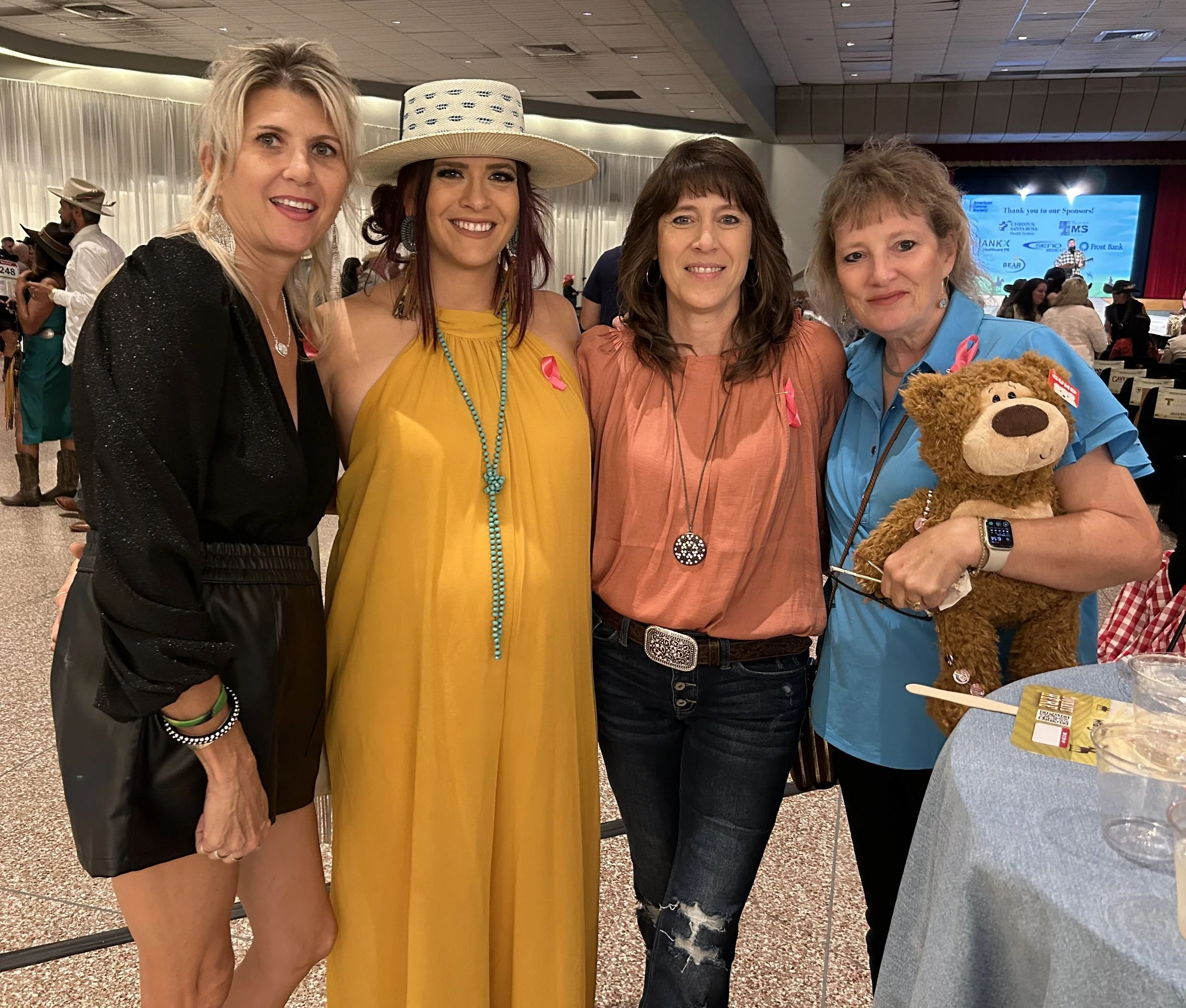 Bonnie Tschirhart, Nicci Tschirhart, Holly Schmidt, and Melissa Zinsmeyer who purchased a teddy bear for a chance to win a prize