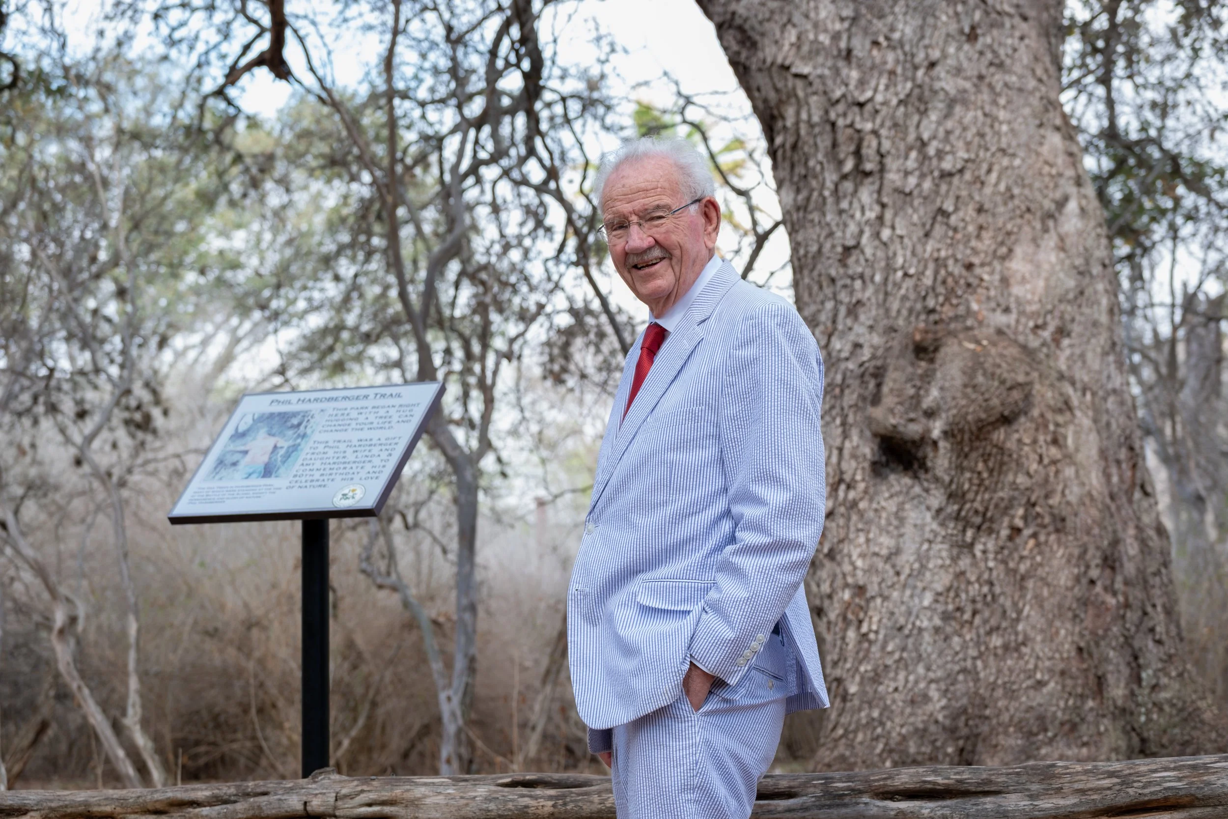 Former San Antonio mayor Phil Hardberger, standing in front of “Phil’s Tree”