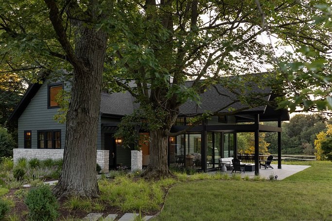 Lake Life / This Michigan Cottage set atop a meadow is an active young family&rsquo;s retreat. Once a tired split level home devoid of charm, this cottage now has a casual vibe perfect for summer days at the beach or cozy winter nights around the fir