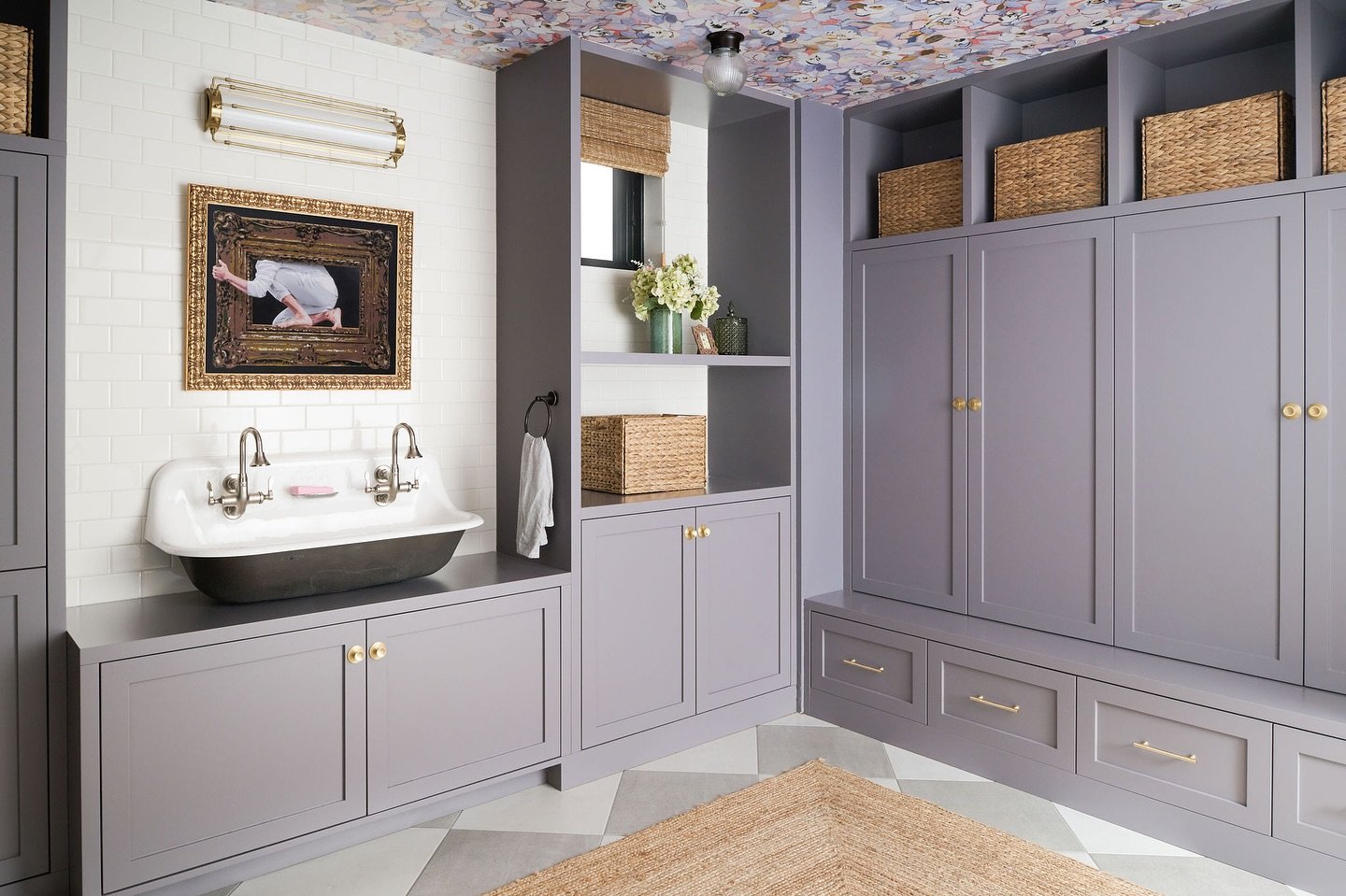 Mudroom / This cheerful lavender mudroom was created in a Lincoln Park home as a solution for organizing all the boots, shoes, coats and sports gear that a vibrant young family has. A wall mounted cast iron sink is the perfect spot for rinsing off a 