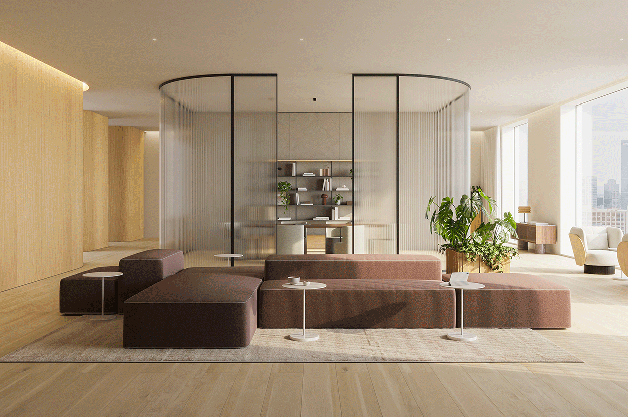 Modern living room with brown sectional sofa, white side tables, large green plants, and floor-to-ceiling windows showing a city skyline.