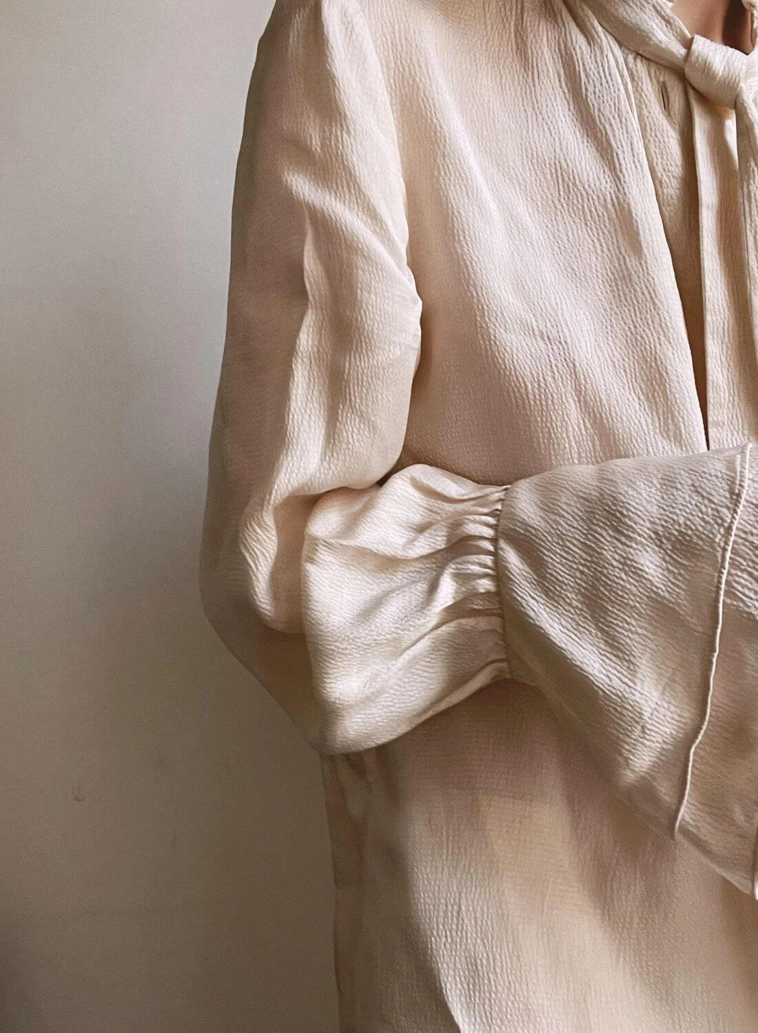 woman in white shirt representing identity.