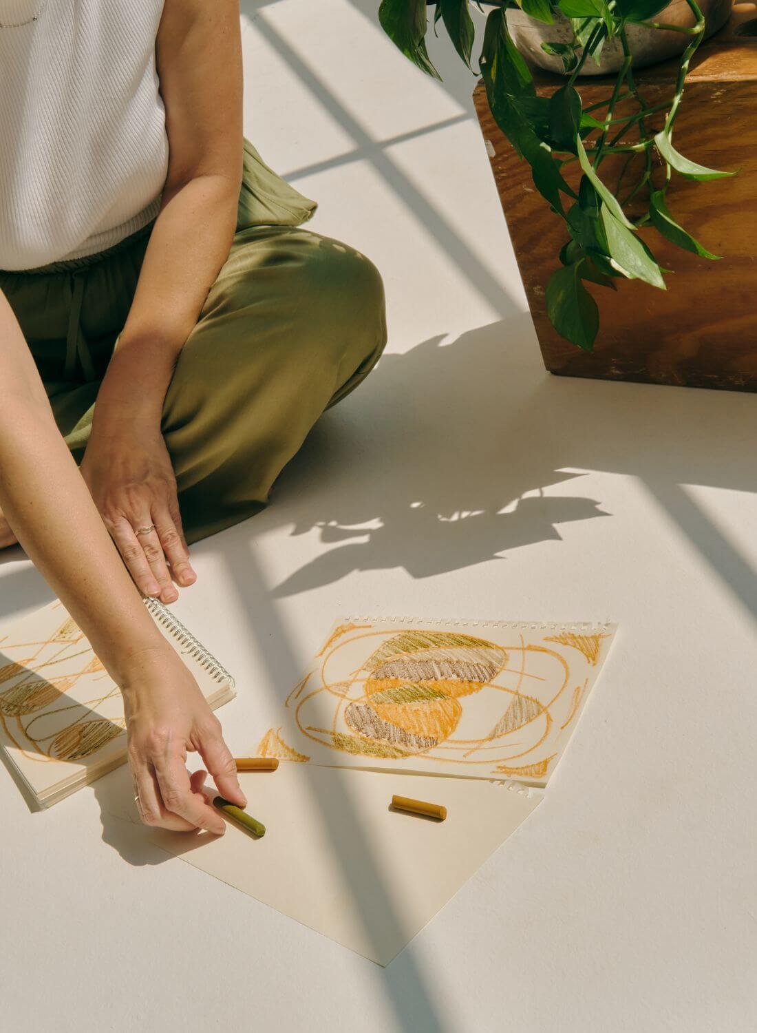 woman doodling on paper representing a multi-creative