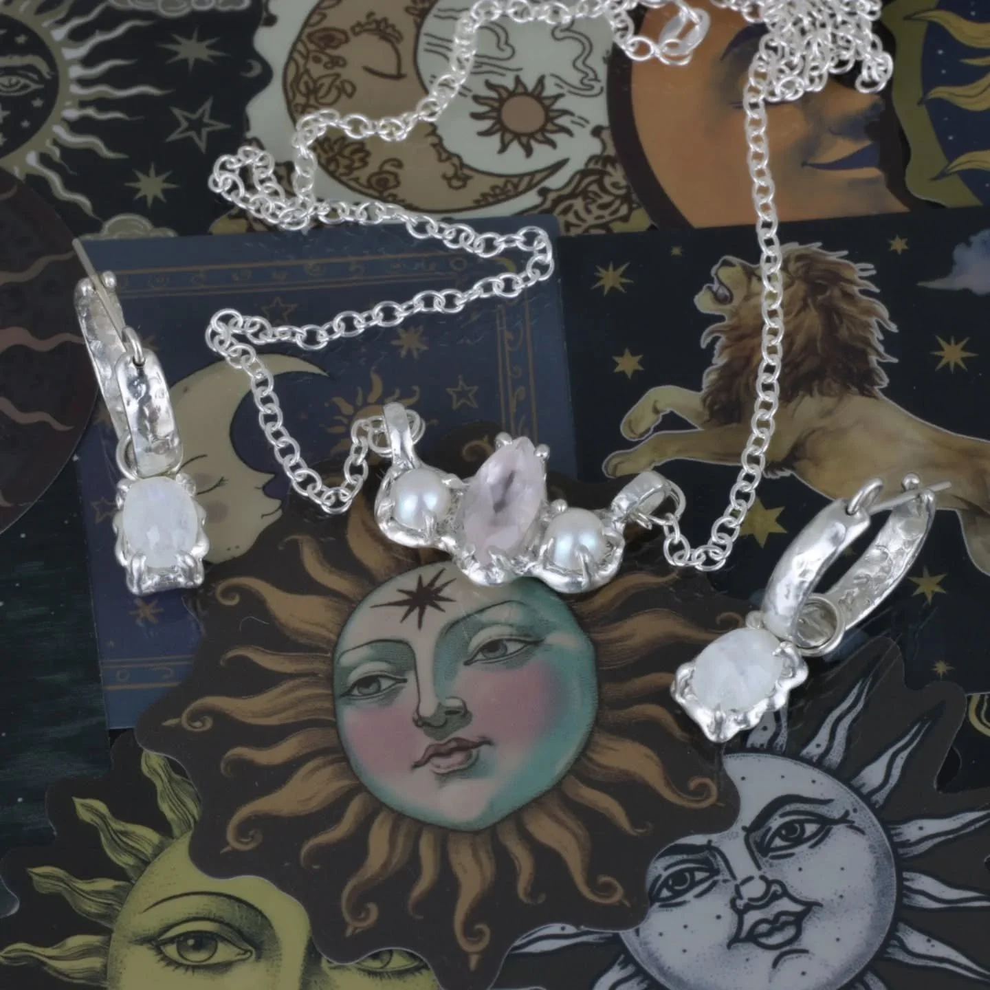 Celestial Charmer and Midnight Mystic are sterling silver sets featuring a pendant and matching hoops.

Bringing a touch of cosmic magic to your everyday style.