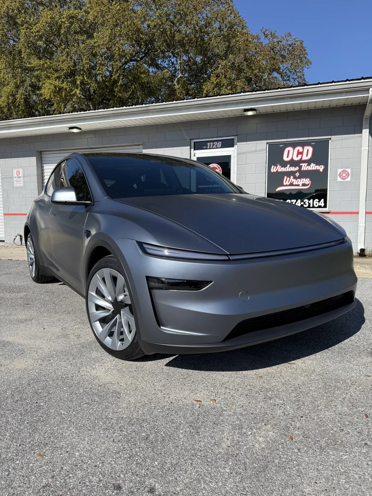 Gray Tesla Model Y outside OCD