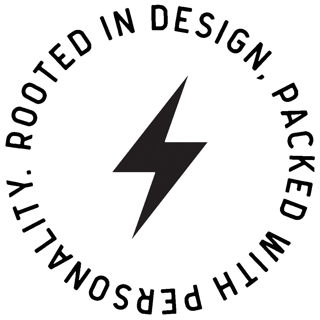 Black lightning bolt symbol with the text "Proudly Rooted in Design. Packed with Passion" surrounding it in a circular shape.