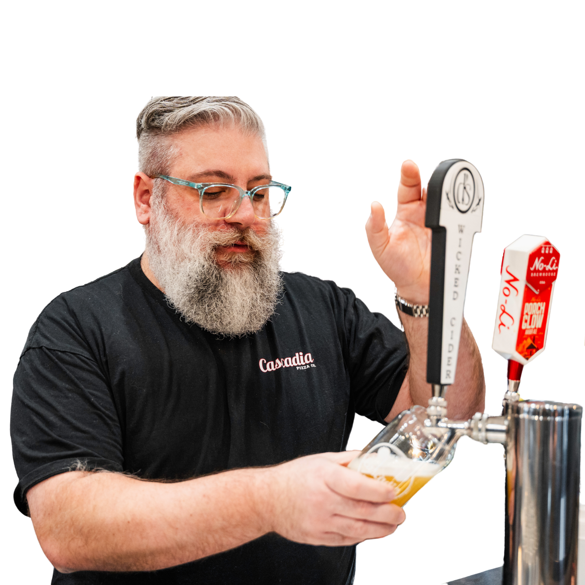 A man with glasses and a beard, wearing a black shirt with the words 'Canada Pizza Co.' on it, is pouring beer from a tap at a bar or brewery.