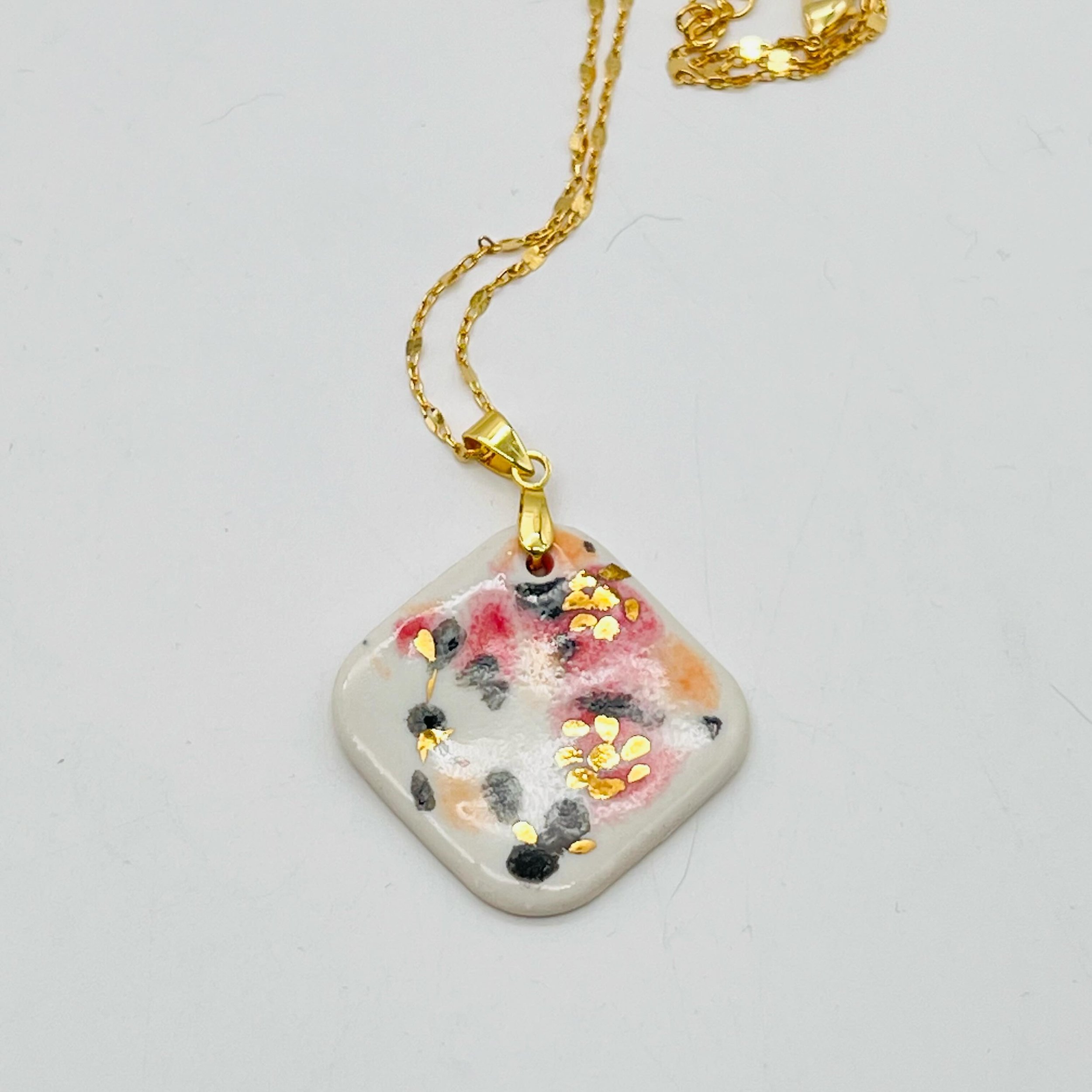 I am thrilled to see how this pendant turned out! Thanks to my friend @gardenhomeva for letting me borrow her necklace to pair with it and encouraging me to stick with my vision. 
.
.
.
#ceramicjewelry #ceramicjewels #porcelainjewelry #ceramicpendant