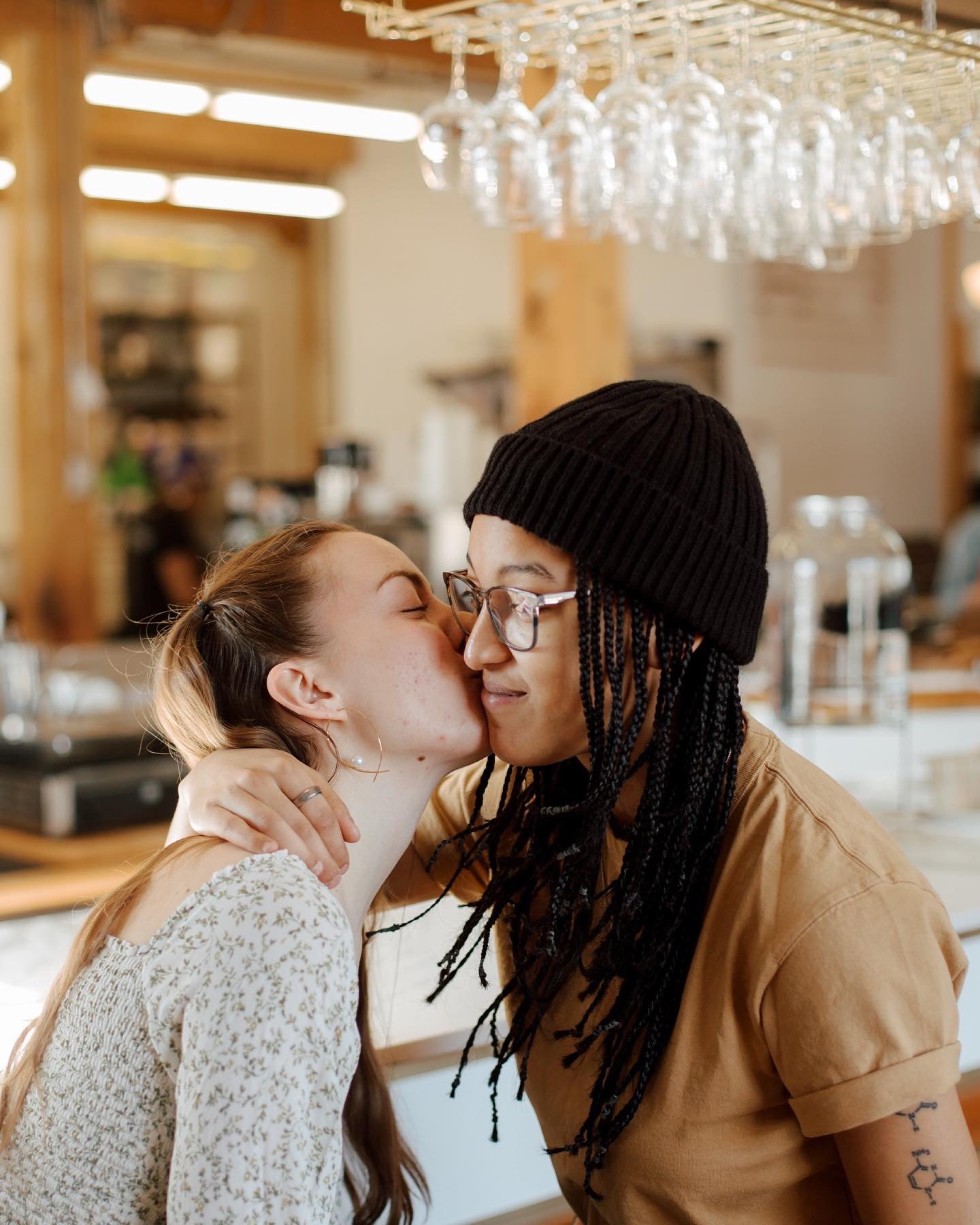 An engagement session photographed in the places A + D go every day, the places where they&rsquo;re most comfortable and mean the most to their relationship. A manages at this caf&eacute; so D keeps her company most of the time working remotely, and 