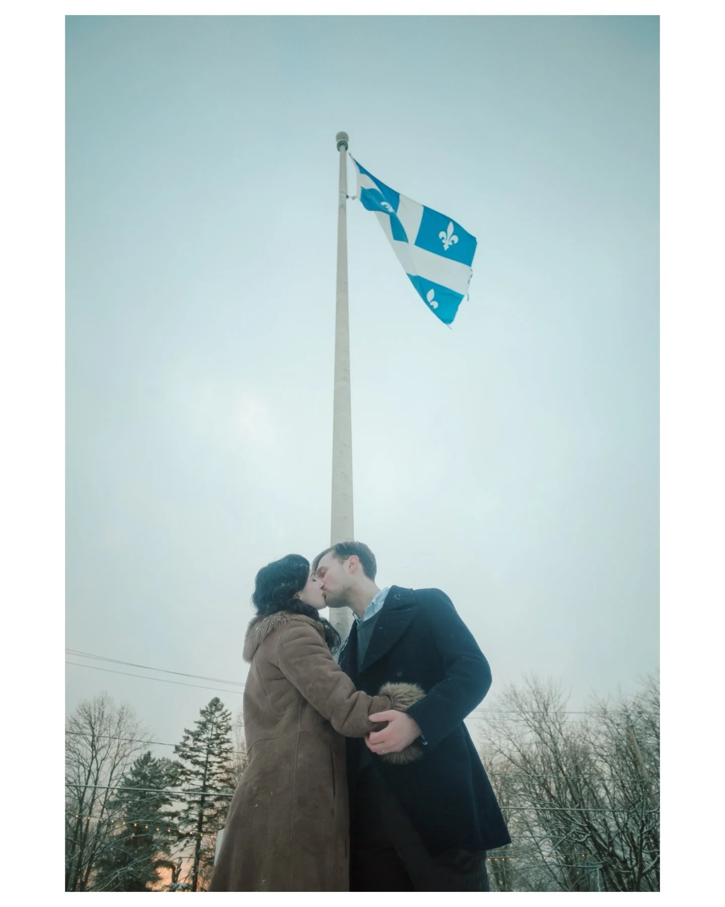 Wedding portraits in a snowy little Quebec town! I learned during his vows that it was significant for Kirill, from Ukraine, to have met his wife Laura here in Canada. It&rsquo;s part of their love story, so when I saw this flagpole I knew I wanted t