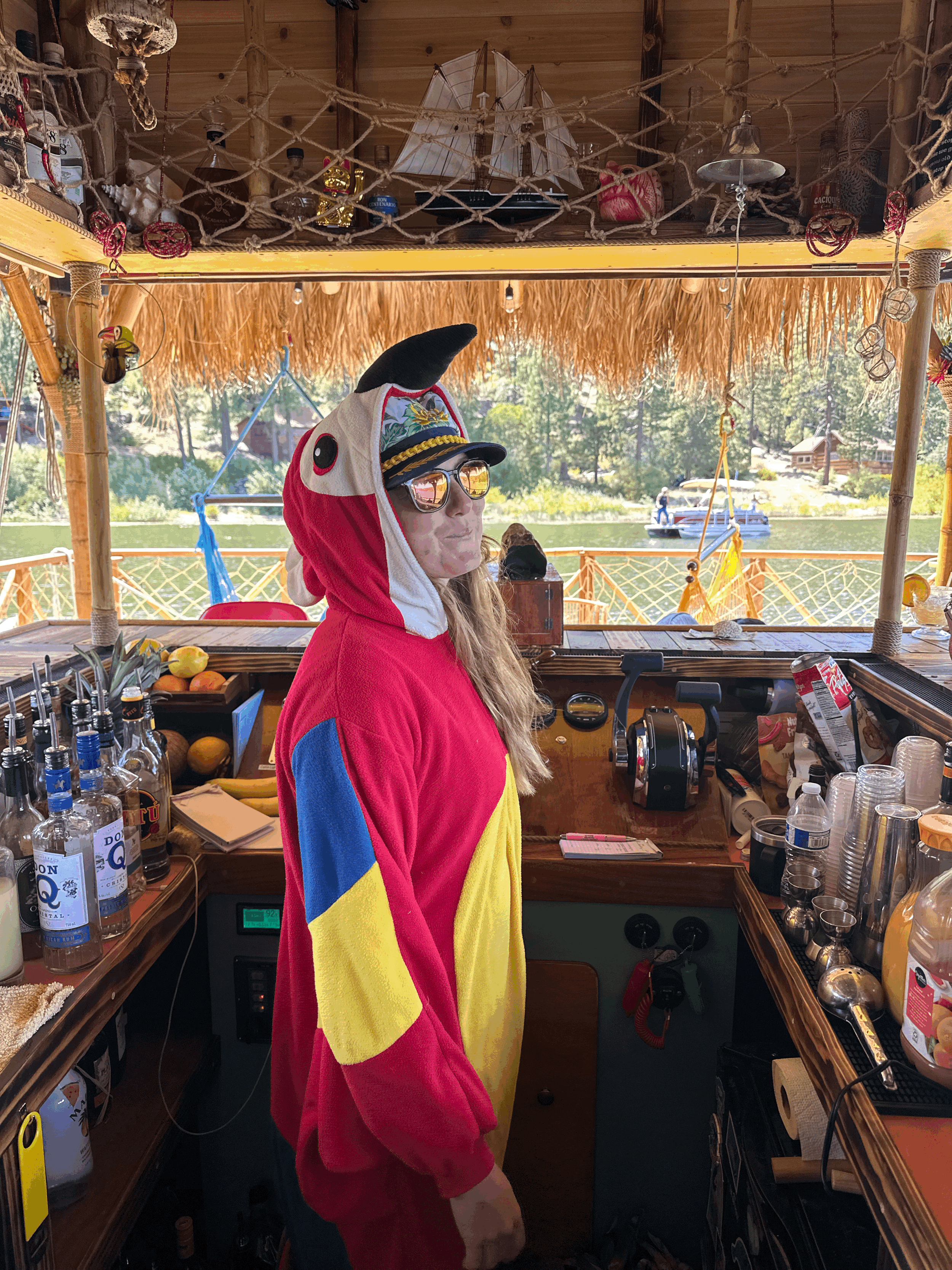 The captain wearing the parrot because she forgot her jacket on the Big Bear tiki boat
