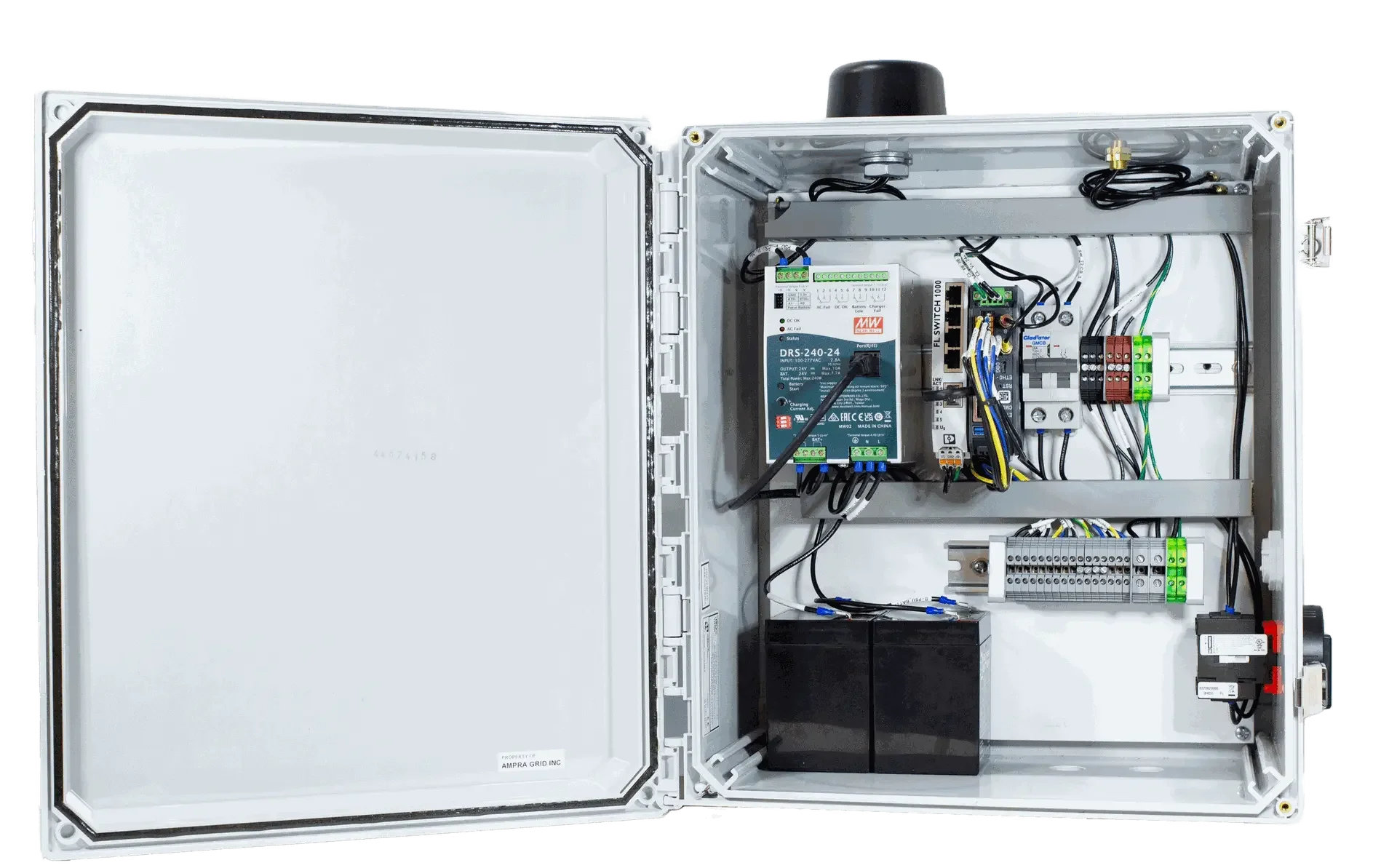 Open electrical control box with wiring, power supply, relays, and circuit components inside.