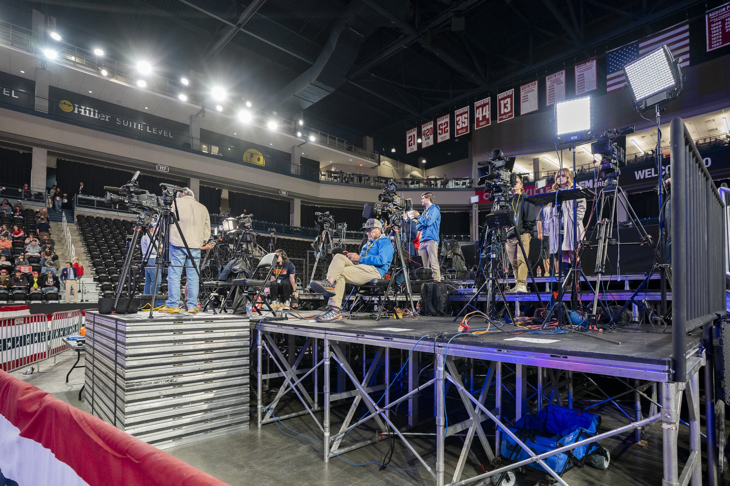  Media sets up on media risers as attendees enter the venue. 