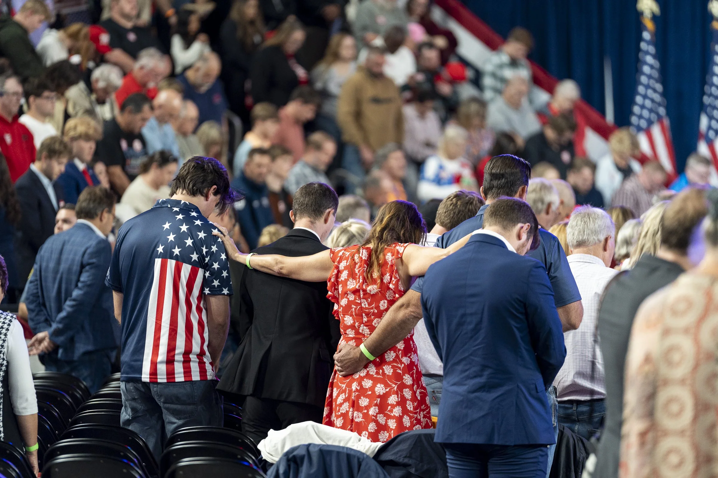  Guests bow their heads during prayer given by Montgomery County Mayor Wes Golden.  