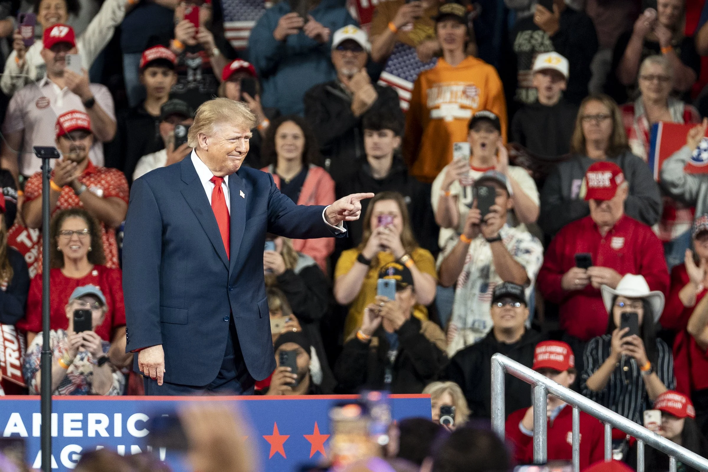  President Donald Trump points toward an attendee as members of the crowd applaud and photograph him during the Republican midterm campaign rally at F&amp;M Bank Arena in Clarksville, Tennessee.  