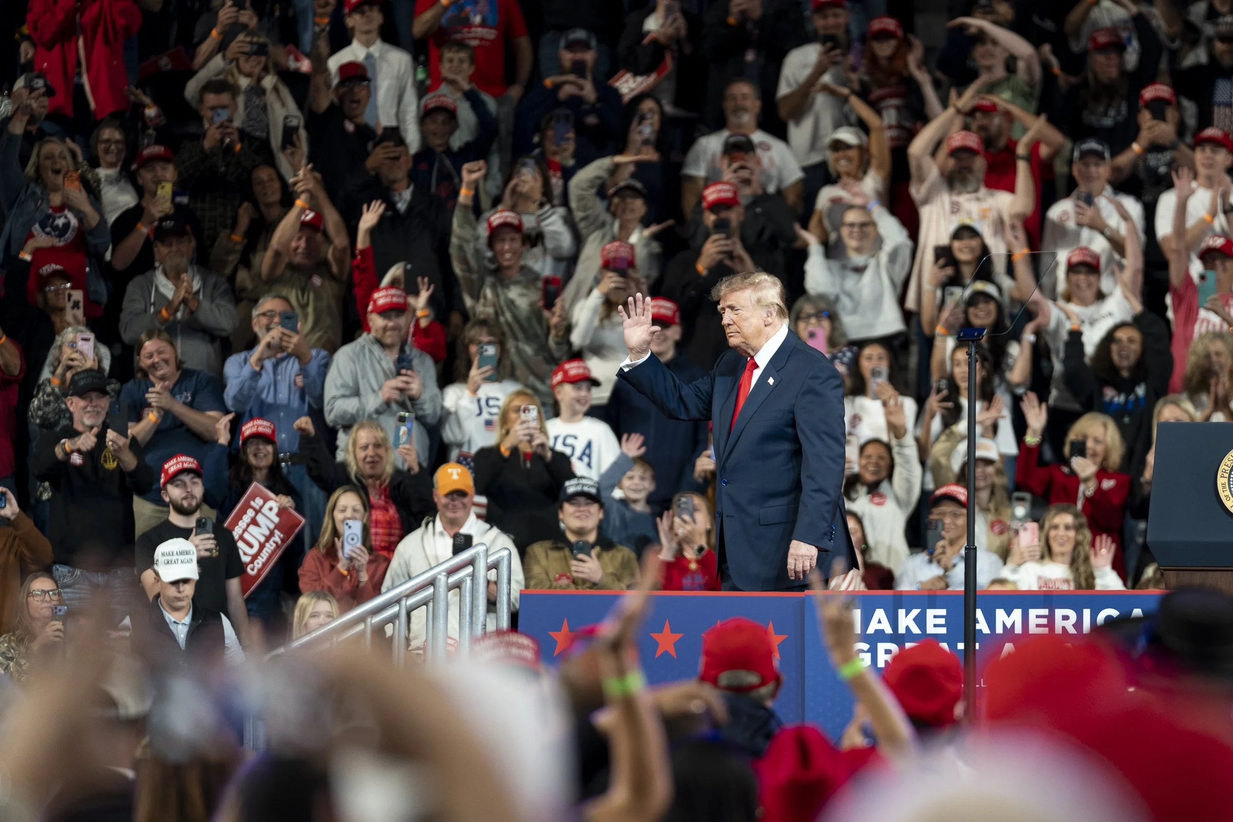  President Trump waves to the crowd as he begins his exit.  