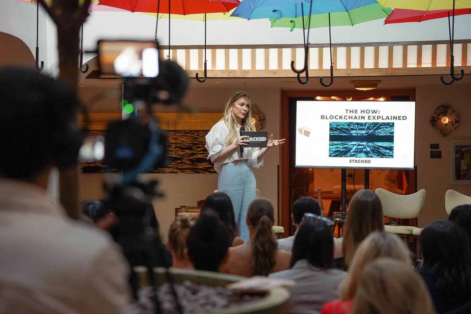 Emily Dempsey presenting on Bitcoin to a room of women at a STACKED event in Miami