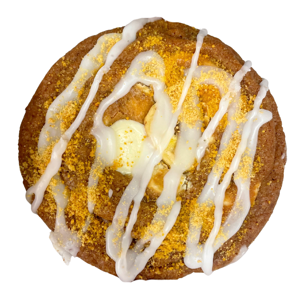 Chocolate chip cookie with colorful candy pieces and melted chocolate.