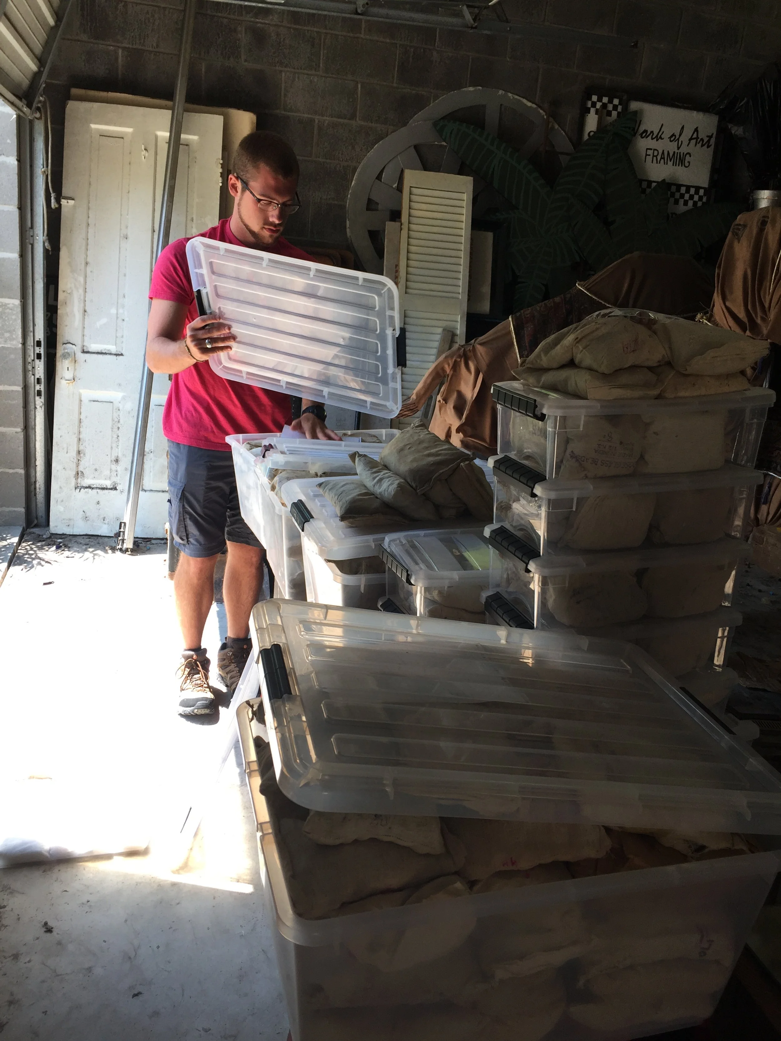 Jules surveys many kilos of beads ready to be taken to their new home.