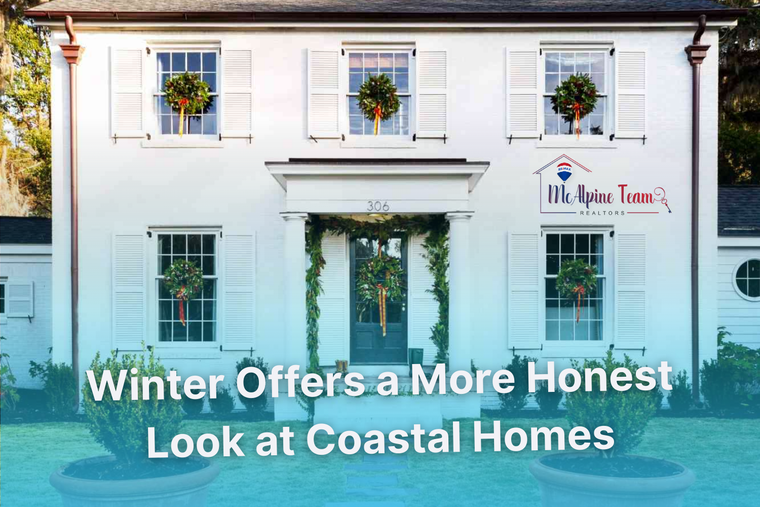 Traditional coastal-style home with white exterior and winter greenery, used to represent how winter can provide a clearer view of a home’s exterior condition