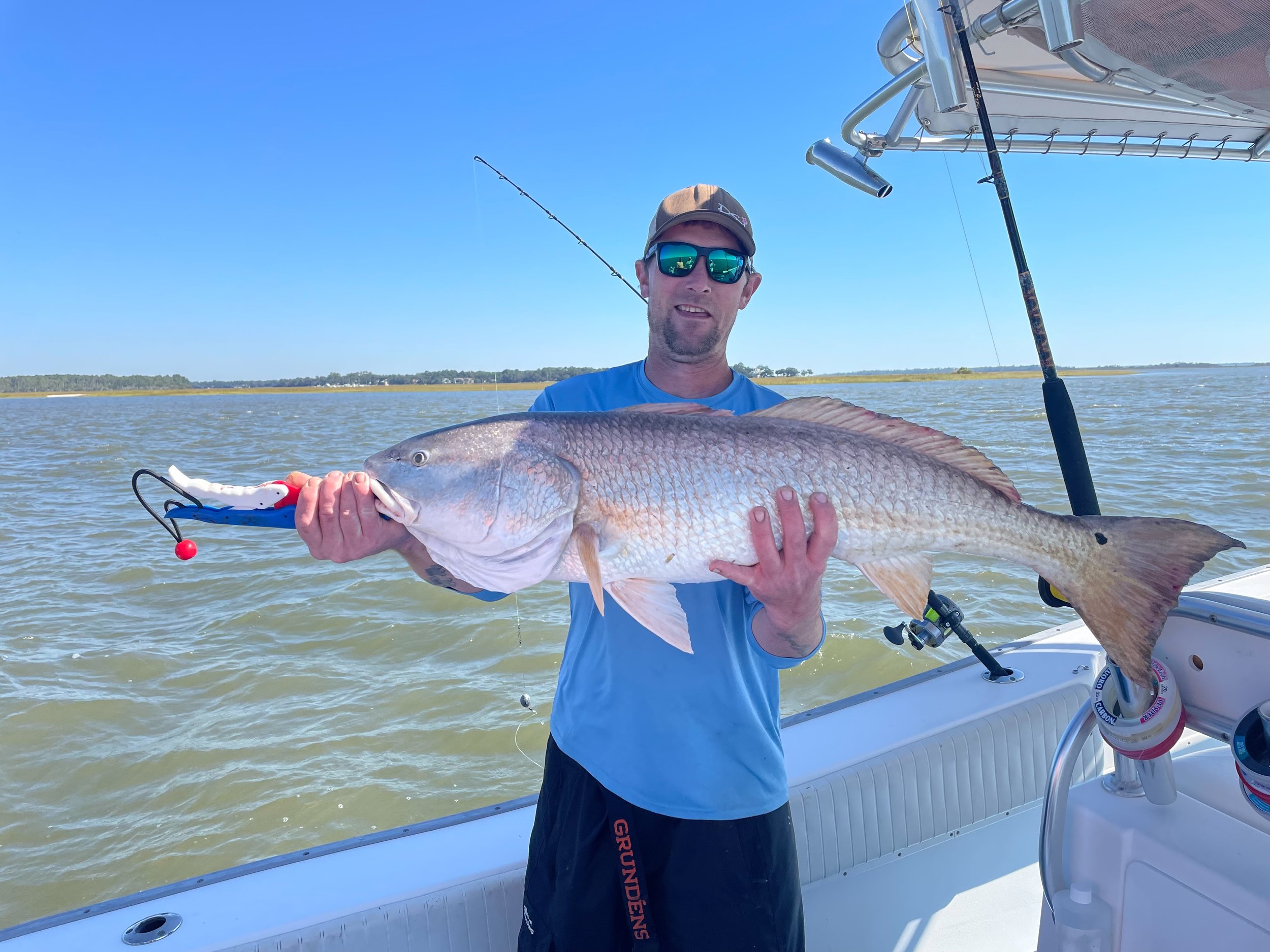 Bottle Koozie w/ Built-in Opener — Fish Tales at Fort McAllister