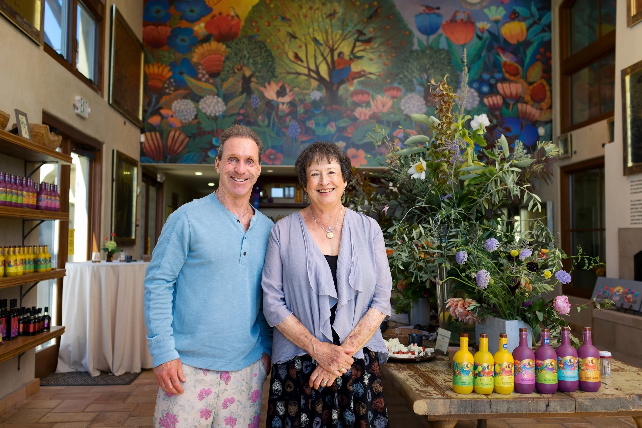 Gold Ridge Organic Farms Farmer Brooke and artist, Terri Sloat, who designed both the mural and the labels for the bottles