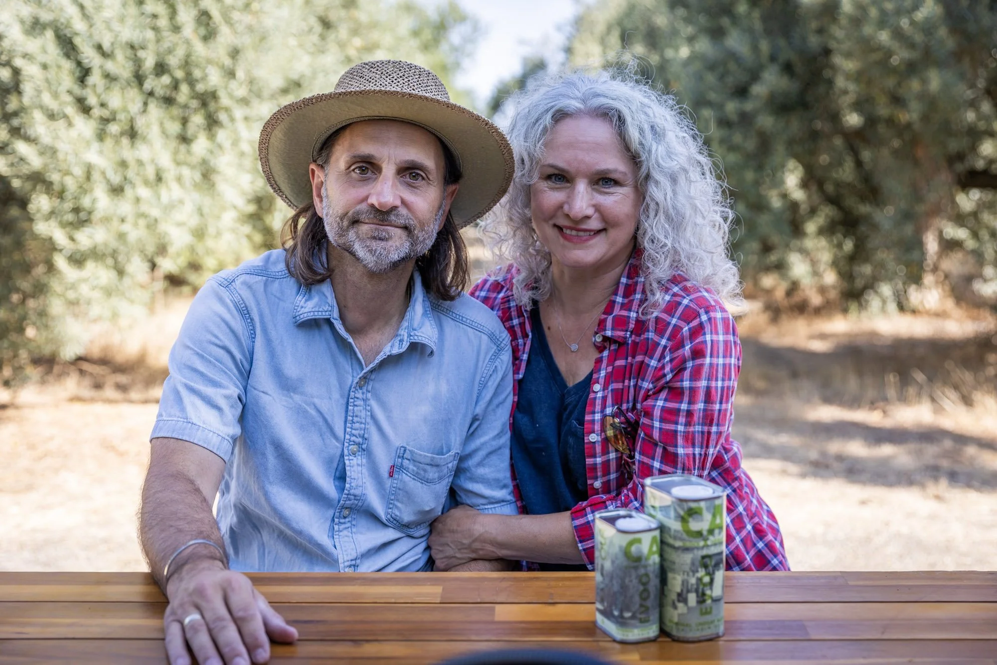 Co-founders Giulio Zavolta and Rachelle Bross with some of their bottlings