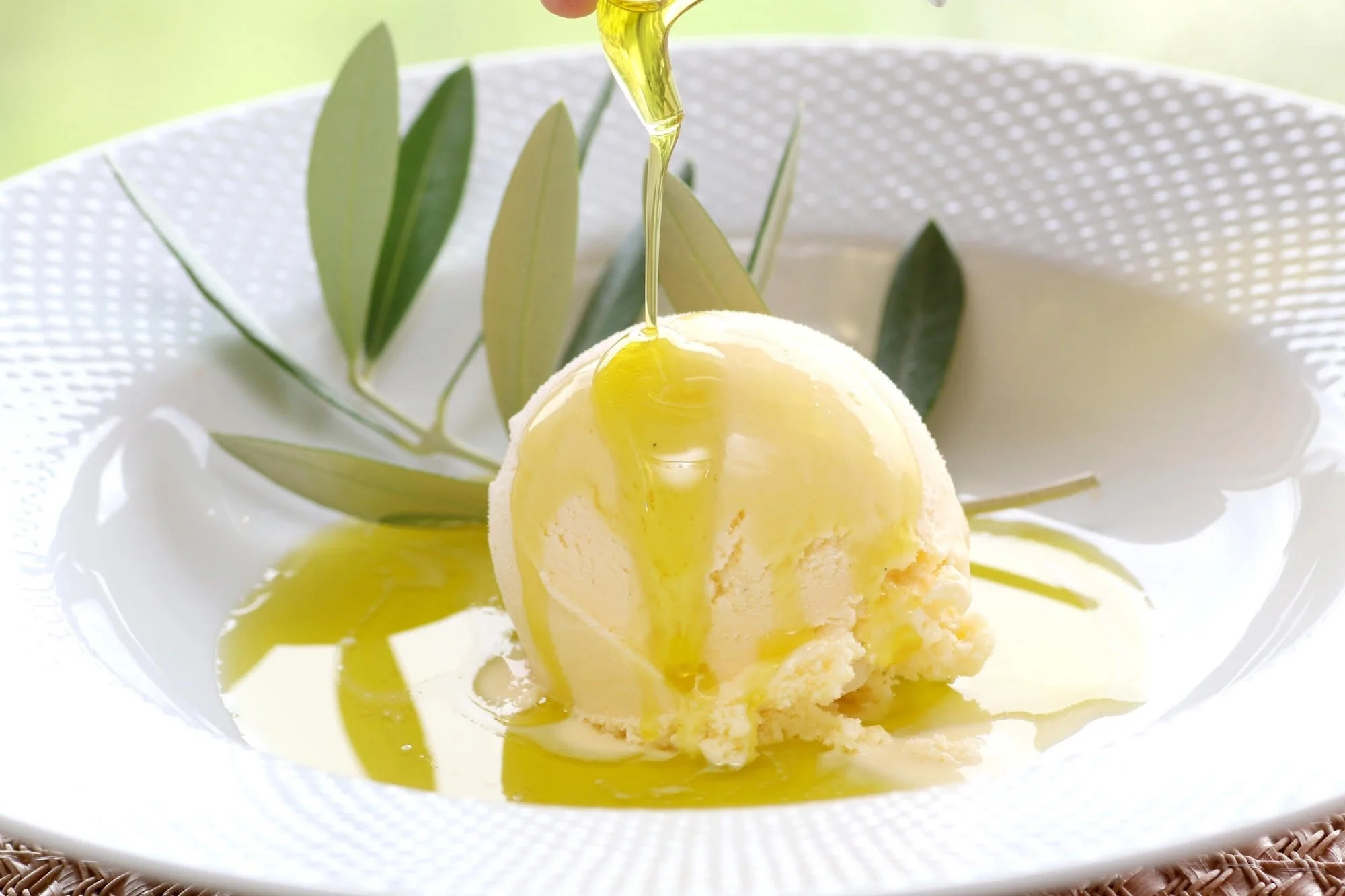 Olive oil drizzled on ice cream