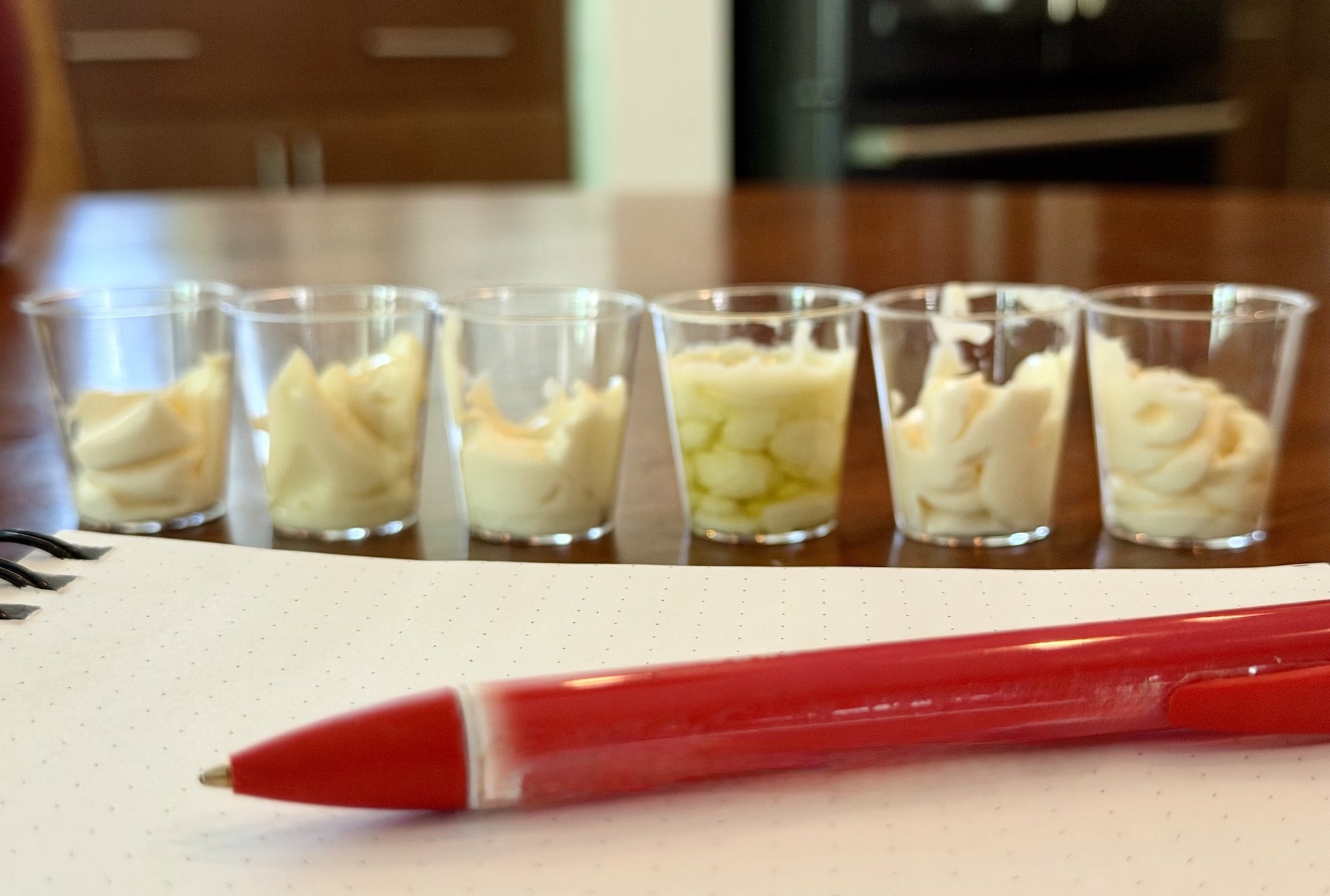 Unlabeled samples of olive oil mayonnaise for tasting