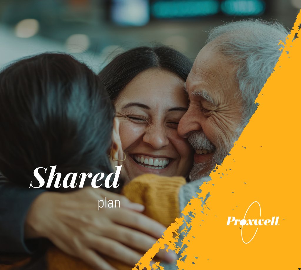 Three people with gray and dark hair hugging and sharing a joyful moment, smiling and laughing closely together.