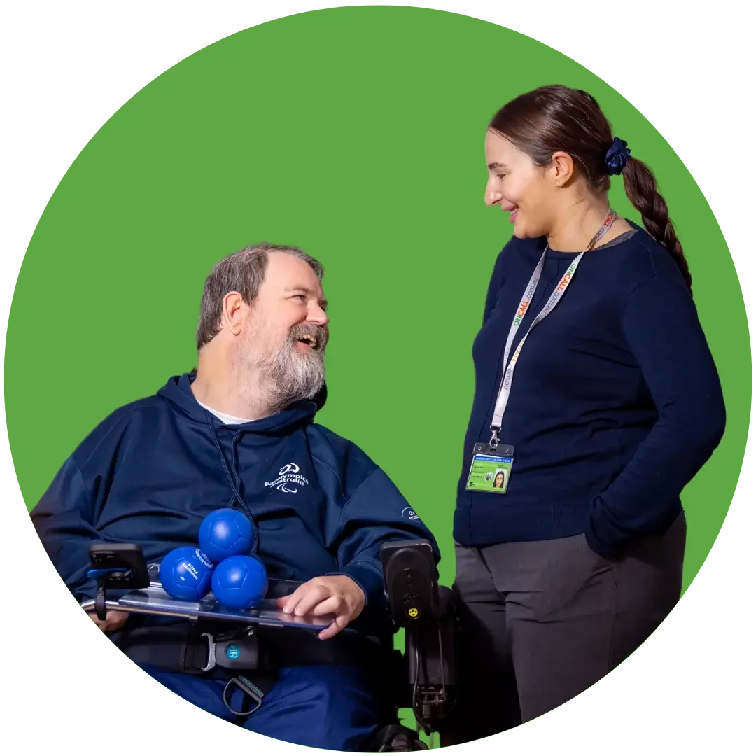 Support worker chatting with wheelchair user during disability support visit