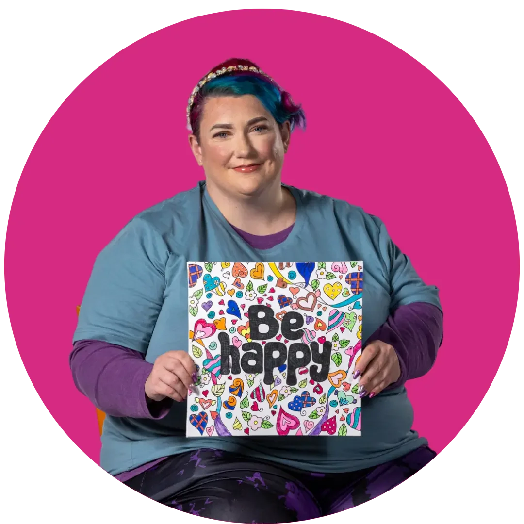 Person holding a colourful “Be happy” sign representing positive in-home support services