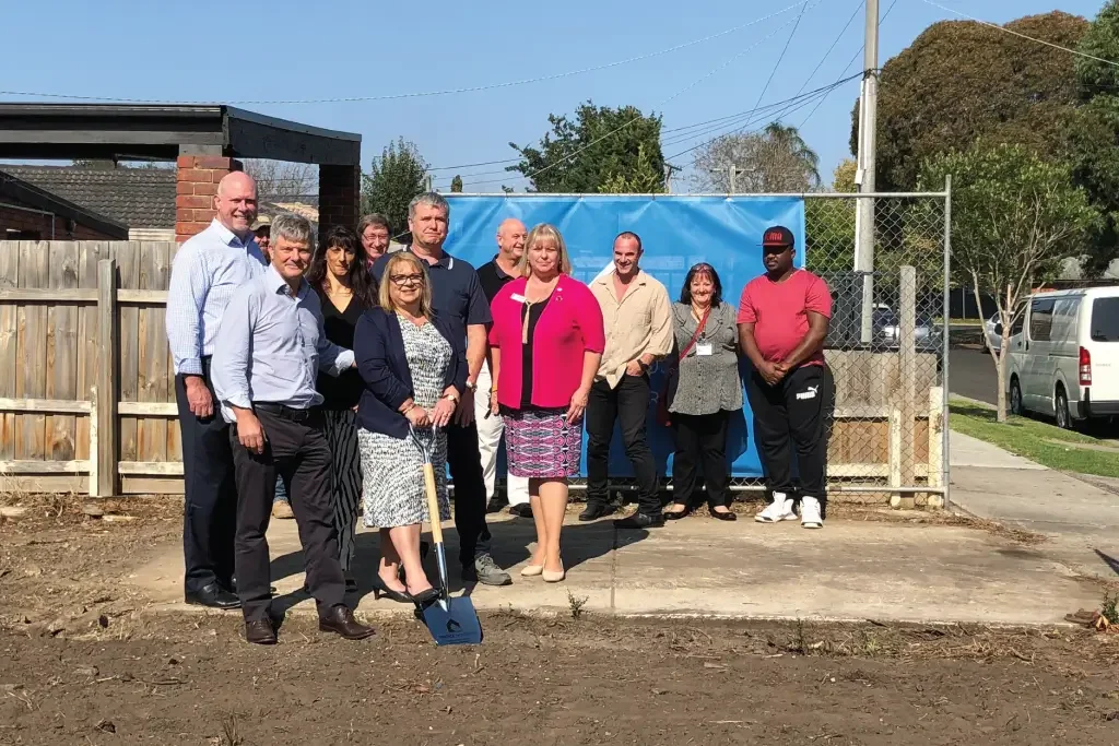 Group gathered at a groundbreaking event for a new SDA home in Cranbourne